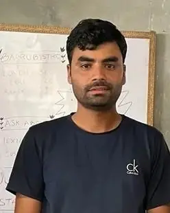 Anup Chhipa standing in front of a whiteboard.