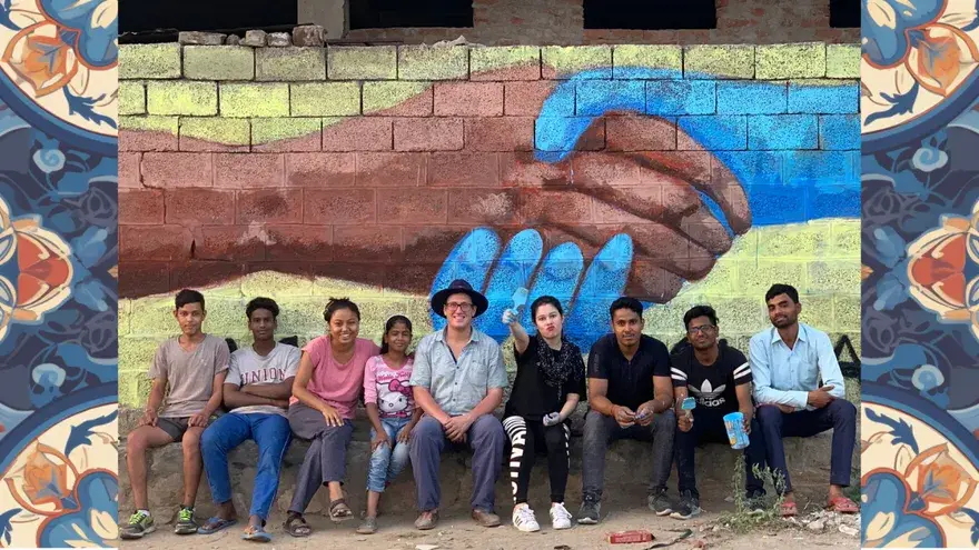 The studio team in front of the Studio Bagru mural.